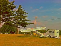  - Entrance to the airport, advertising 24-hr fuel and 7-day restaurant - by Murat Tanyel