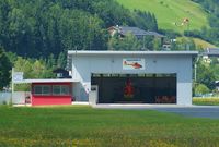  - The homebase of the AlpinHeli 6. It is ready to be pulled out of the hangar where the pilots are waiting in the lounge to fly.  - by Jorrit de Bruin