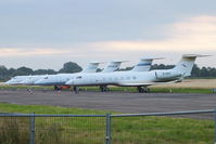  - bizjets parked at Cranfield with visitors for the opening of the London 2012 Olympic games. From L to R are B-8098, N450JR, N780W and B-8097 - by Chris Hall