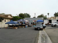 - First Sunday Aviation Museum of Santa Paula Open House & Fly-In-invited car collector vendors setting up shops early-a full band played music all day-was a free huge audience draw! - by Doug Robertson
