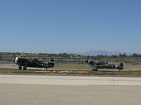  - Real Thunderbolt N3395G and replica Spitfire N1940K taxi to 26 - by Doug Robertson