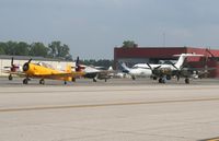  - ramp overview P-38, T-6, 2 P-47s and a couple DC-9s at Thunder Over Michigan - by Florida Metal