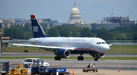  - US Airways Airbus taxing with the US Capitol in the background - by Ronald Barker