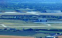 - Overview of Leipzig/Halle Airport on a sunday afternoon,

left below: old radar tower and fire training range, middle: runway 26R/08L, tower and new AN124 hangar,
above: runway 26L/08R, DHL Air Hub with aprons and hangar. - by Holger Zengler