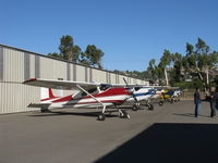  - Five Cessna 180s and a Cessna A185 on display at the Aviation Museum of Santa Paula taxiway. Aircraft displays change every First Sunday Fly-In and Open Museum Hangars crawl - by Doug Robertson
