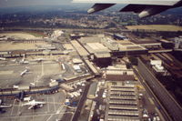  - Scanned from original slide taken in early September 1991.  The view is of the then Terminal buildings (later to be South Terminal) and rail station, taken from departing NorthWest Airlines flight to MSP. - by Neil Henry