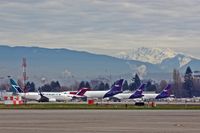 - Westjet taxis past cargo area. - by metricbolt
