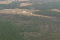  @ NONE - Looking west at LJ Fussell airfield (uncharted) near Broxton, GA.  Note the high tension lines across the south end of the runway. - by Bob Simmermon