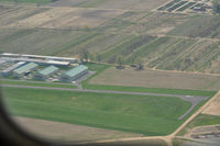 - On left downwind for RW 09, looking at the west end on the airport - by tshiverd