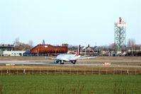  - View on taxiway echo 6, rwy 26R and fire training center with old radar tower..... - by Holger Zengler