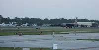  - B-52 just landed on Rwy 7L, a couple crew members guiding it to back taxi - by Florida Metal