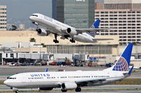  - United #653 departing RWY 25R enroute to IAD, and United #1735 arriving from EWR, off of RWY 25R at H8. - by Mark Kalfas