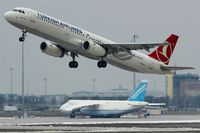  - Outbound traffic on rwy 08L passing resting AN 124 on apron 3... - by Holger Zengler