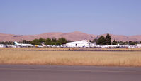  - Tower and hangar area from the West side of the field at 6pm. - by Bill Larkins