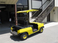 - The airport has many forms of personal ground transport. Here is an electric vehicle that can cleverly seat four. - by Doug Robertson