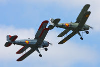  - CASA 1-131E Jungmann's G-BZJV and G-CDJU displaying at the Vintage Aircraft flyin, Sleap - by Chris Hall
