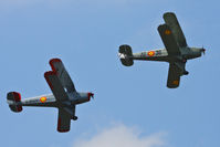  - CASA 1-131E Jungmann's G-BZJV and G-CDJU displaying at the Vintage Aircraft flyin, Sleap - by Chris Hall