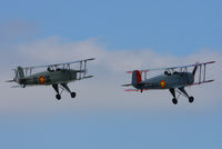  - CASA 1-131E Jungmann's G-BZJV and G-CDJU displaying at the Vintage Aircraft flyin, Sleap - by Chris Hall