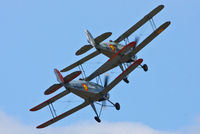  - CASA 1-131E Jungmann's G-BZJV and G-CDJU displaying at the Vintage Aircraft flyin, Sleap - by Chris Hall
