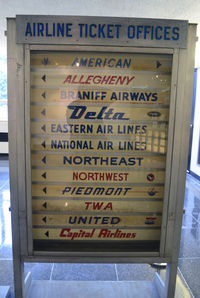  - Airline signs from the past at National Airport.  Of the 12 airlines, only American, Delta and United remain. - by Ronald Barker