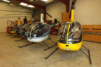  - R22's in the Heli Air hangar at Wellesbourne Mountford - by Chris Hall