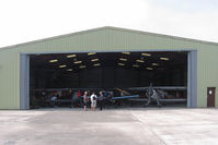  - A hangar full of Buckers. Bucker Fest - Wings & Wheels, The Real Aeroplane Club, Breighton Airfield, July 14 2013. - by Malcolm Clarke
