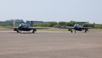  - Line up of Aero L-29 Delfins of the Red Star Rebels at Swansea Airport prior to displaying at the Wales National Air Show. - by Roger Winser