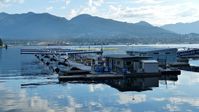  - Early Sunday morning overlooking Harbour Air terminal in Coal Harbour.  The North Shore mountains line the background. - by M.L. Jacobs