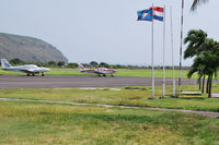  - Some private aircraft on parking positions at EUX. - by Tomas Milosch