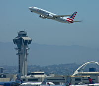  - American Airlines (N804NN) is departing between the Tower and the Tom Bradley Building - by A. Gendorf
