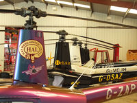  - R22's in the Heli Air hangar at Wellesbourne Mountford - by Chris Hall