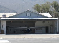  - 31 Cessna Taxi. Santa Paula Airport's Do-It-Yourself Paint Shop Hangar. Rarely seen with an open door. - by Doug Robertson
