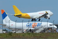  - Big Baby for apron 4 east and small freighter on apron 2 both engaged in serving DHL Air Hub Leipzig with parcels and more...... - by Holger Zengler
