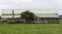  - Foreground, Barber, Shoemaker & Tailors Shop. Middleground, Double gas decontamination chambers. Background,  Side opening Admiralty 'F' shed. - by Derek Flewin