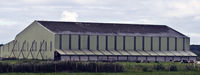  - Side opening Admiralty 'F' shed originally built around 1916 for seaplanes and re erected here in 1930. The farmer has added extensions on each side. - by Derek Flewin