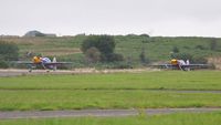  - Visiting ExtremeAir XA-41's of the Red Bull Matadors about to depart Runway 22. - by Roger Winser