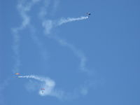  - Three parachutists doing stunts with smoke opening the Wings Over Camarillo Airshow 2013. - by Doug Robertson