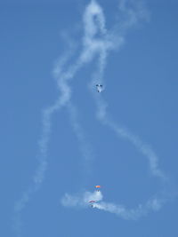  - Three parachutists doing stunts with smoke opening the Wings Over Camarillo Airshow 2013 - by Doug Robertson