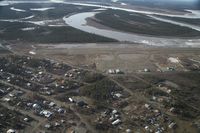  - Fort Yukon, Alaska during breakup of the Yukon River prior to minor flooding of runway.  Taken from Wright Air N4637U piloted by Dave Lorring. - by David Lee
