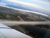  - Looking over the airport flying down runway 304T Hall Beach - by Tim Kalushka