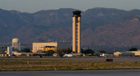  - The control tower at evening.  The tower controls both domestic and military operations as this airport is jointly used by Kirtland Air Force Base. - by Roland Penttila