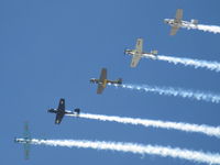  - Warbirds in echelon flight with smoke over CMA - by Doug Robertson