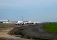 - Aircrafts queue on taxiway at SOEKARNO-HATTA International Airport Jakarta. In 2012 / 2013 CGK has ranked 9th bussiest airport in the world (link : http://www.world-airport-codes.com/world-top-30-airports.html  ) - by NN