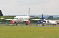  - Storage area with HA-FAH and un-reg'd A320 - by John Coates