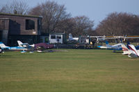  - A view towards the restaurant (left), outside seating area (middle) and part of the flight line. - by Howard J Curtis