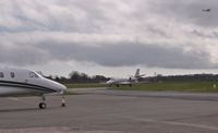  - View from Citation Centre with CS-DFV arriving to join M-IMOR and G-AWOT departing behind. - by John Coates