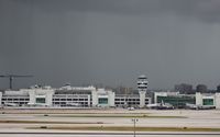  - Miami's American Airlines terminal with storm to the south - by Florida Metal