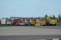  - Fire engines lined up after a KLM 737 diverted to Norwich following a problem on a flight from Manchester to Amsterdam. - by Graham Reeve
