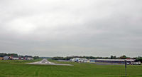  - Panoramic view of the airport, looking west, at the threshold of the main runway. - by Daniel L. Berek