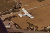  @ 33 Strip Airport - 42E flying over 33 Strip in 1987.It was closed around 2010 with a new airport several miles to the east being built. Road at bottom of picture is Hy 33 . - by S B J